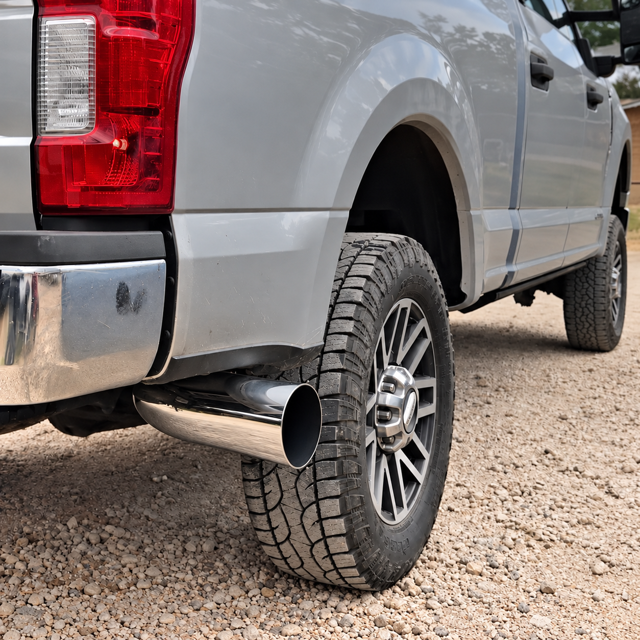 Truck exhaust with a polished chrome elbow tip installed
