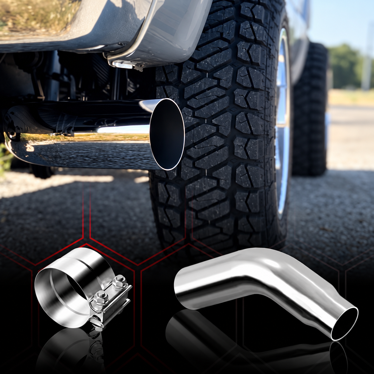 Chrome exhaust elbow tip and clamp shown on a pickup truck with a large off-road tire