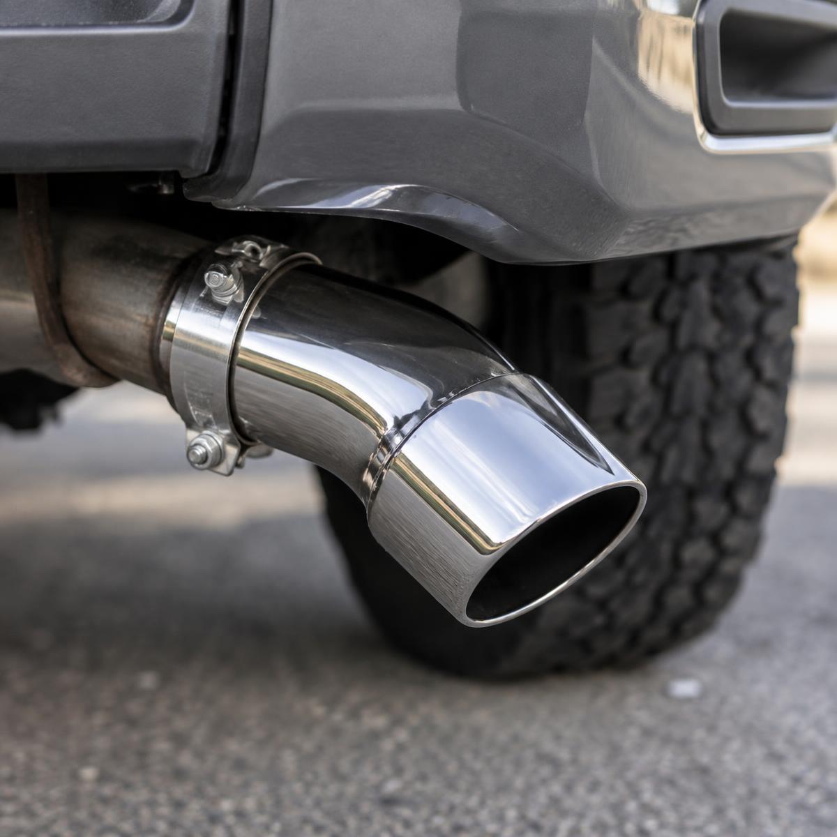 Chrome exhaust elbow tip installed on a pickup truck